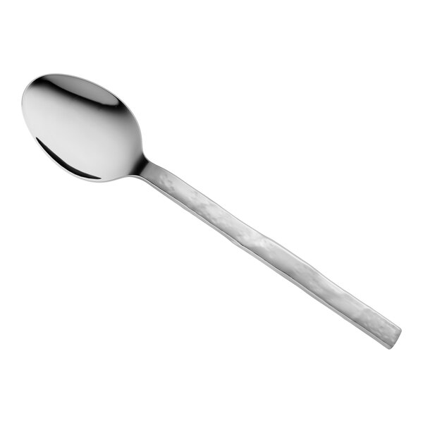A stainless steel teaspoon with a textured handle.