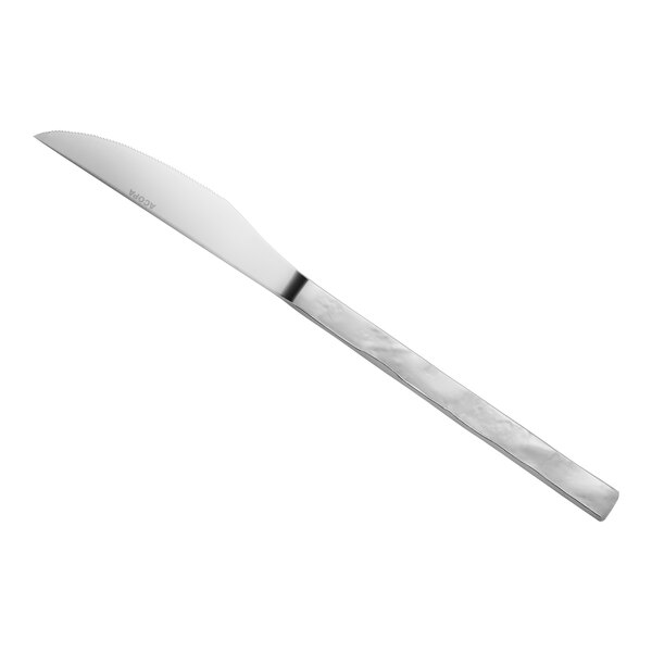 A stainless steel steak knife with a textured handle and a slightly curved, serrated blade.
