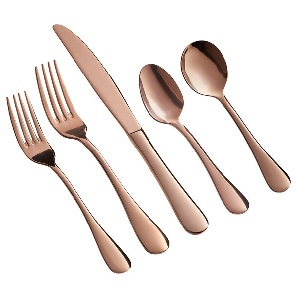 A five-piece set of rose gold stainless steel flatware including two forks, a knife, and two spoons.