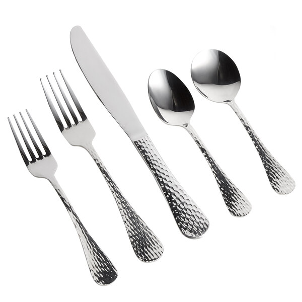 A five-piece set of stainless steel flatware with textured handles, including two forks, a knife, and two spoons.