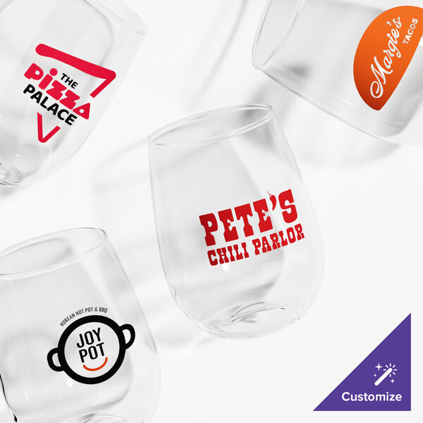 Four clear stemless glasses are shown, each with a different custom logo or design printed on the front.