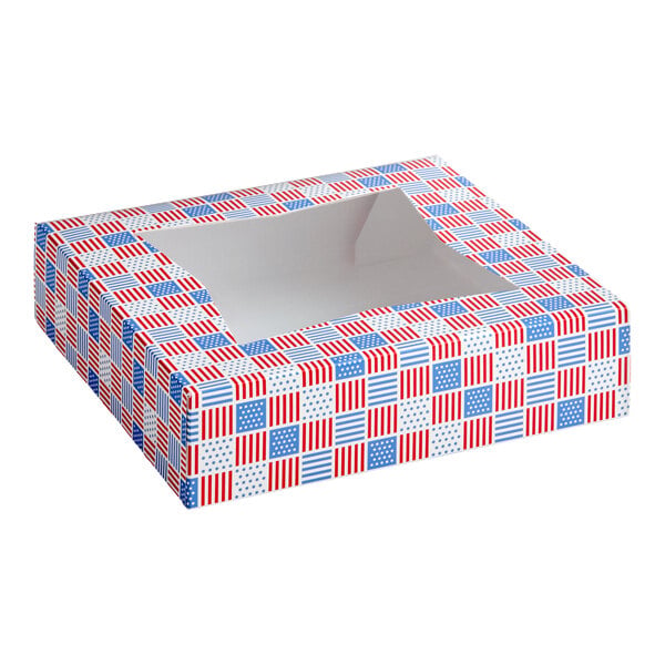 A square bakery box with a clear window on top, decorated with a red, white, and blue patriotic USA print.