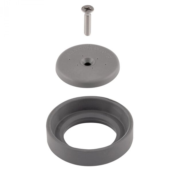 A grey plastic circular object with a screw hole and a screw.