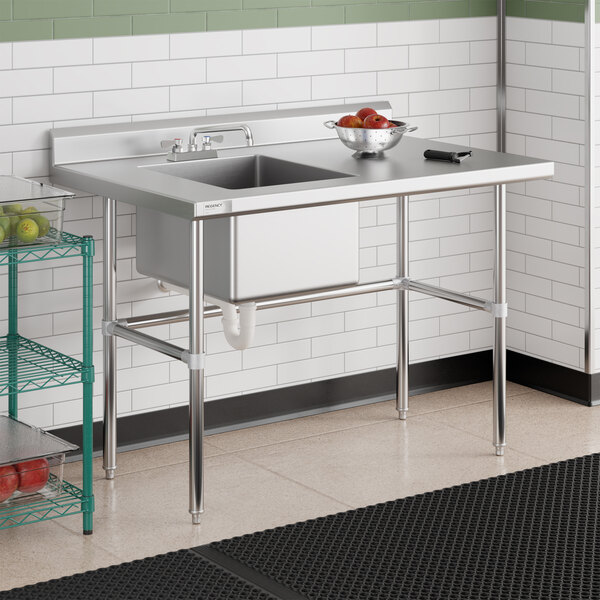 A stainless steel work table with a left-side sink and cross bracing, measuring 30 by 48 inches.