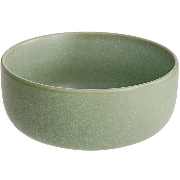 A round, sage green bowl with a matte finish and smooth texture.