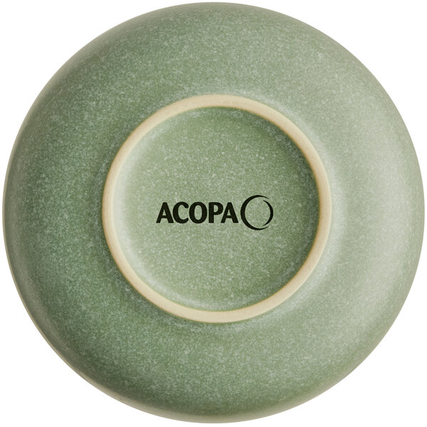 The image shows the underside of a sage green bowl with a matte finish and the word 'ACOPA' printed on the base.