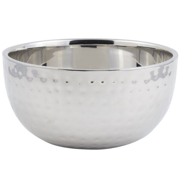A silver stainless steel Bon Chef double wall bowl with a hammered finish and a handle.