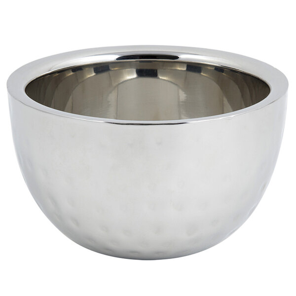 A silver stainless steel Bon Chef double wall bowl with a hammered finish and a handle.