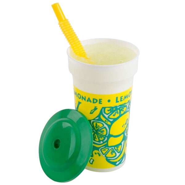 A 16 oz. clear plastic lemonade cup with a yellow straw and green lid.