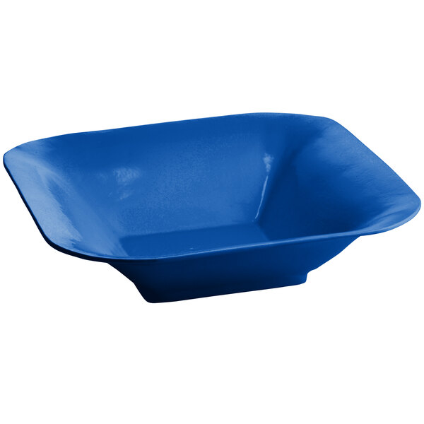 A cobalt blue square bowl on a white background.