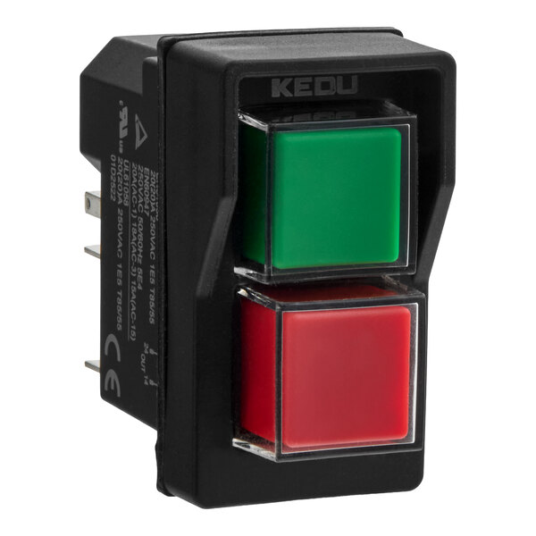 A rectangular black control switch with two square buttons, one green and one red, and metal prongs on the side.