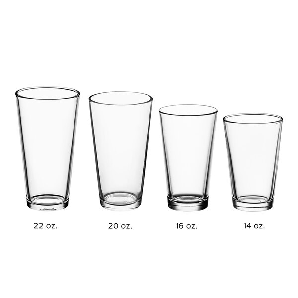 A clear 20 oz. rim tempered mixing glass, shown alongside other glass sizes for comparison.