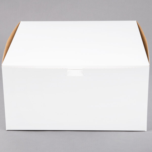 A plain white cardboard bakery box with a closed lid.