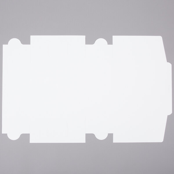 A flat, unfolded white cardboard sheet designed to be assembled into a 12" x 12" x 6" cake or bakery box.