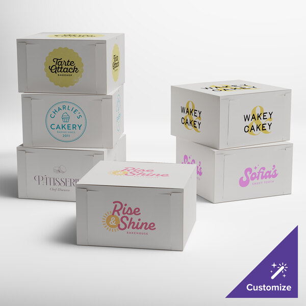 A set of customizable white bakery boxes with various bakery logos printed on them.