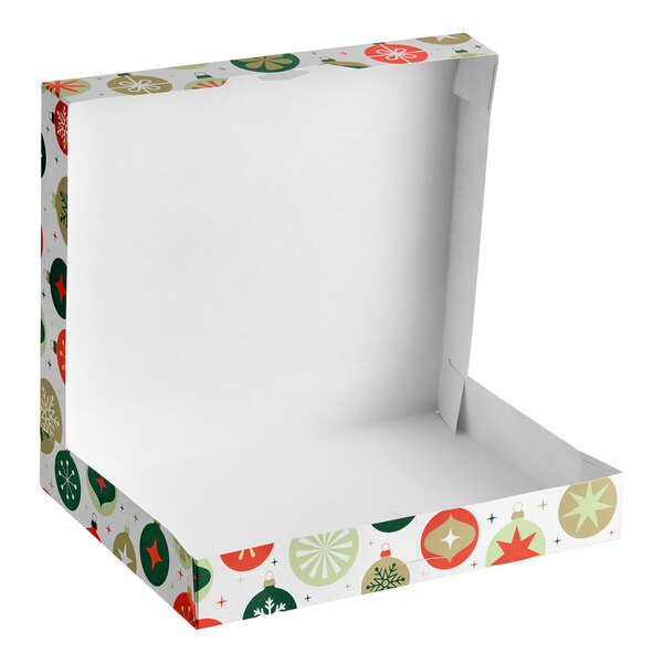 An open, empty white box with colorful ornament designs on the sides and lid.