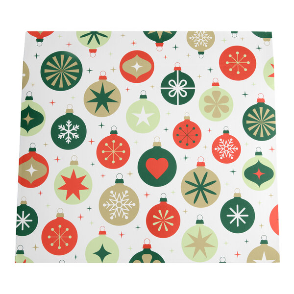 A sheet with a festive pattern of red, green, and gold Christmas ornaments featuring various designs on a white background.