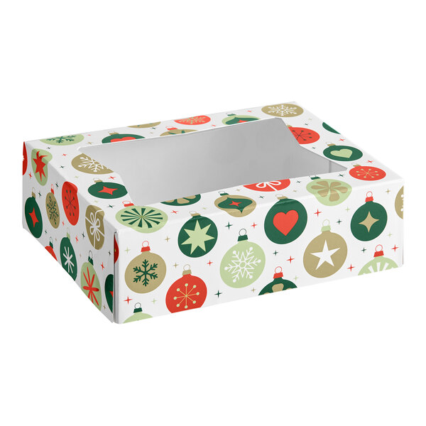 A rectangular box with a clear window on top, decorated with colorful Christmas ornament patterns in red, green, and gold.