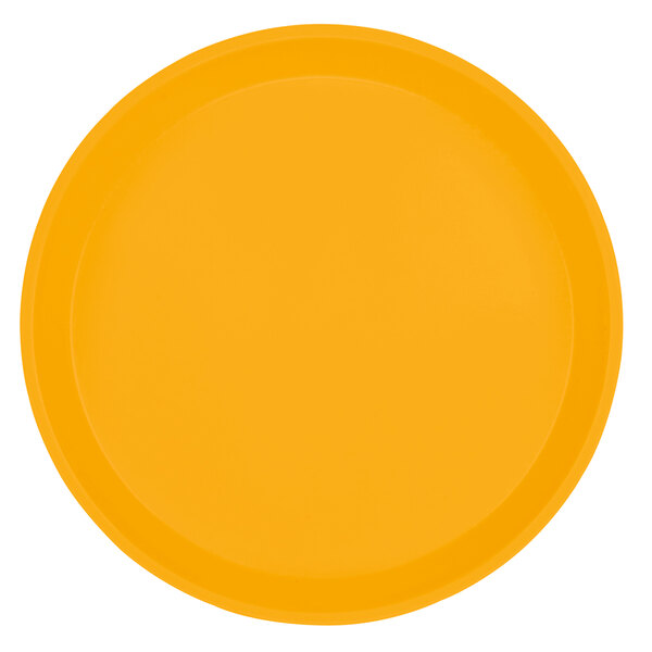 A close-up of a yellow Cambro round tray.