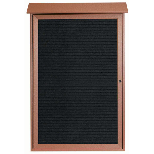 An outdoor brown framed notice board with a black board.