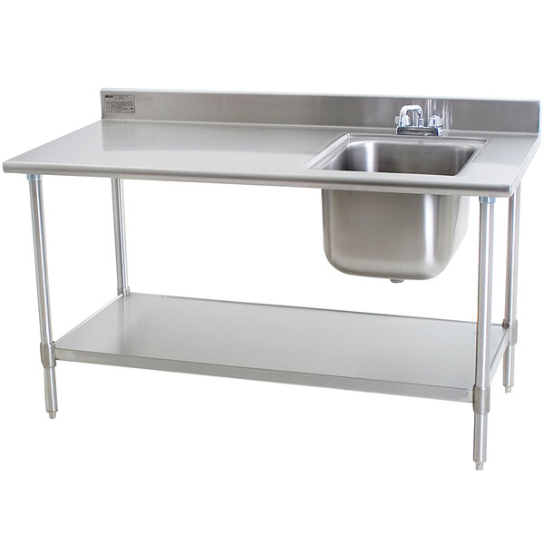 A stainless steel work table with a sink on the right.