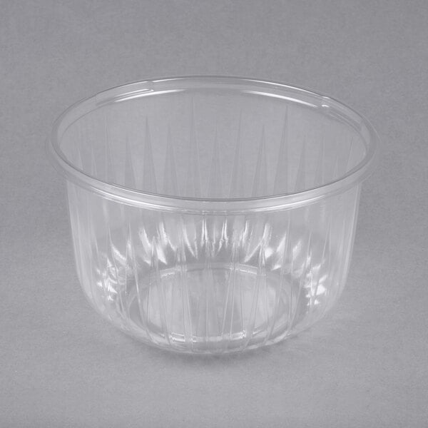 A clear plastic Dart PresentaBowl with a curved edge.