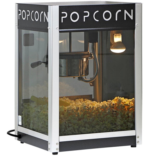 A Paragon Contempo Pop popcorn machine with a bucket of popcorn.