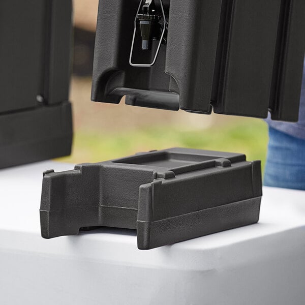 Cambro Camtainers® 4 9/16" Black Riser for 2.5, 4.75, and 5.25 Gallon Cambro Insulated Beverage Dispensers R500LCD110