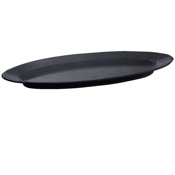 A black oval Tablecraft cast aluminum King Fish Platter with blue speckle on a counter.