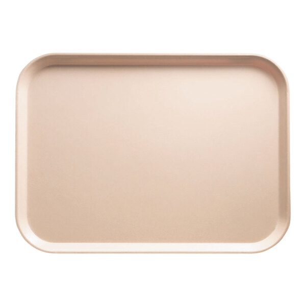 A rectangular light peach Cambro tray on a counter.
