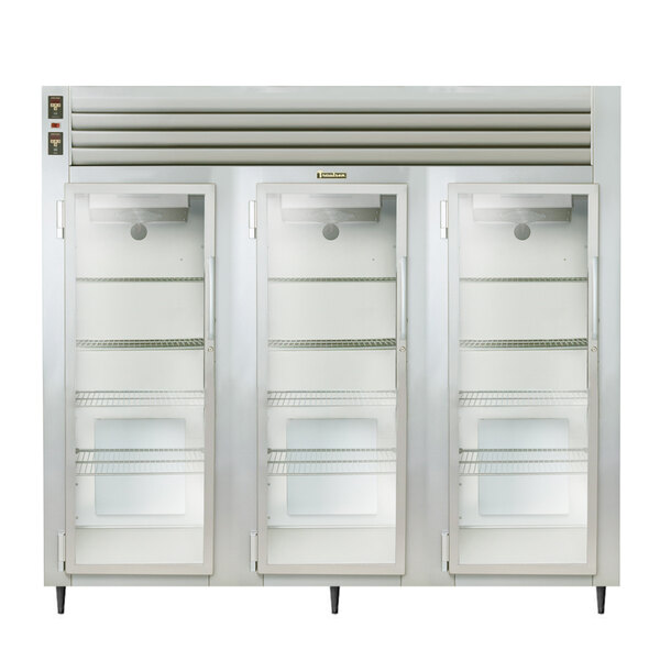 A white Traulsen refrigerator with three glass doors.