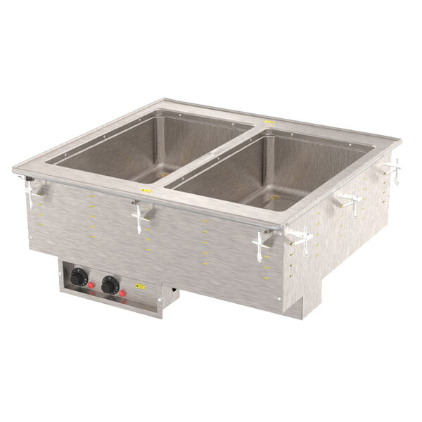 A Vollrath two compartment drop-in hot food well on a counter with food pans inside.