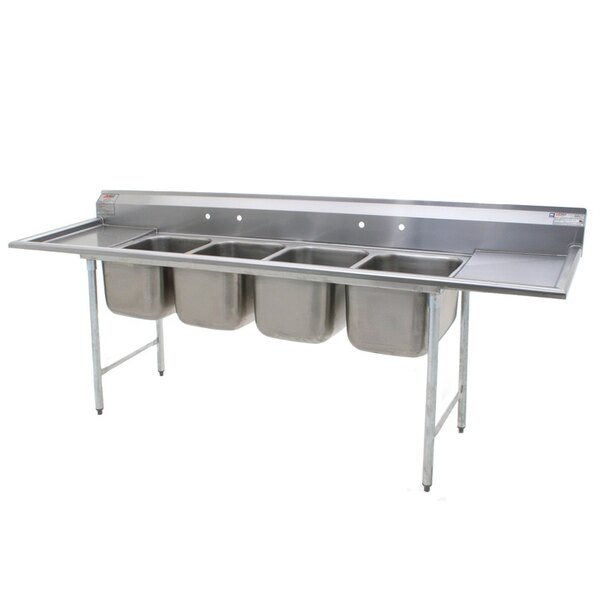 A stainless steel Eagle Group four compartment sink with two drainboards.