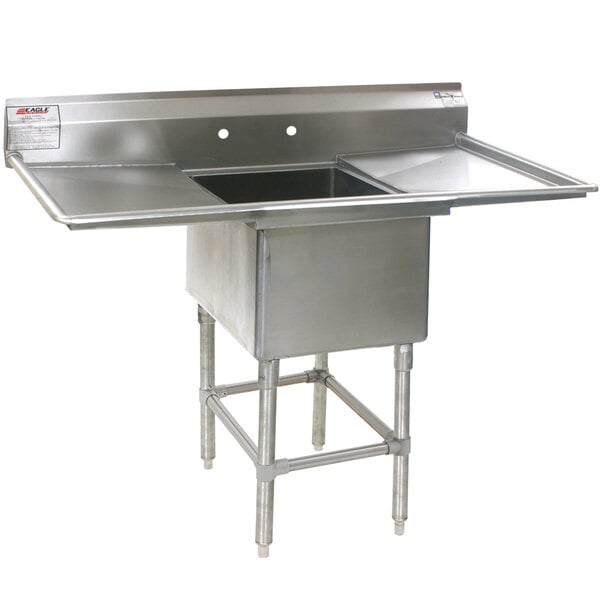 A stainless steel Eagle Group commercial compartment sink with two 18" drainboards.