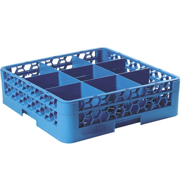 A blue plastic Carlisle glass rack with six compartments and a 1 extender.