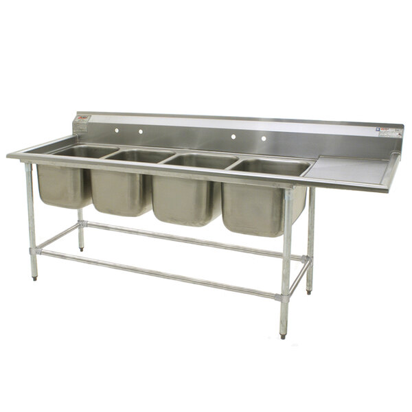 A stainless steel Eagle Group 4 compartment sink with right drainboard.