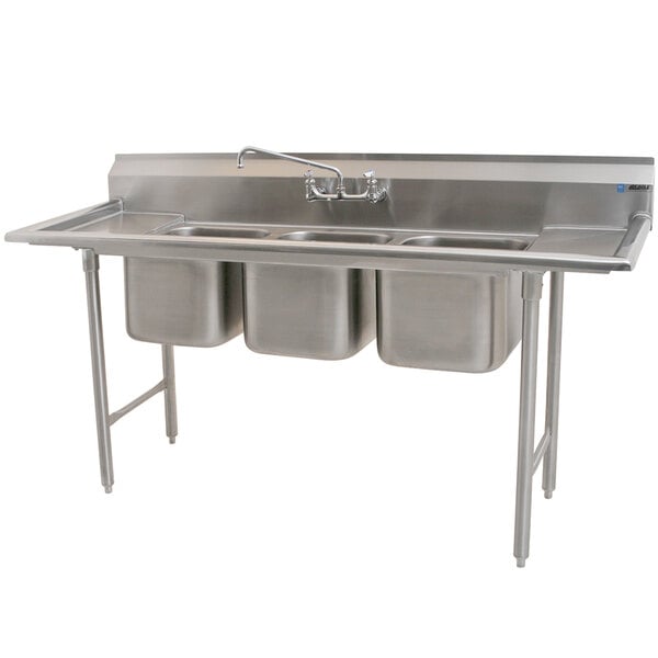 A stainless steel Eagle Group 3 compartment sink with 2 drainboards.