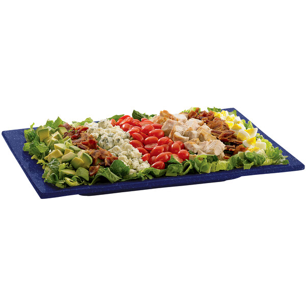 A Tablecraft blue speckled rectangular metal platter with salad toppings on it.