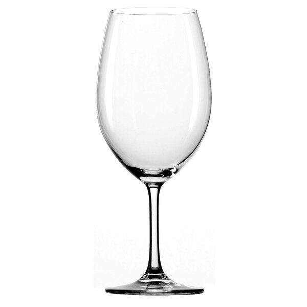 A close-up of a clear Stolzle wine glass with a stem.