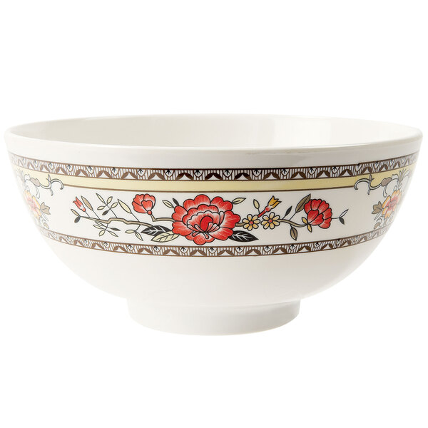 A white melamine bowl with red flowers on it.