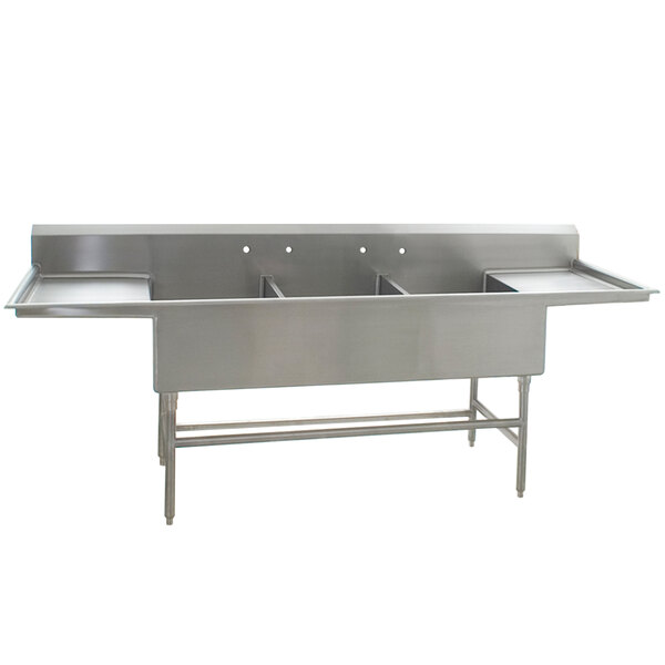 A stainless steel Eagle Group three compartment sink with two drainboards.