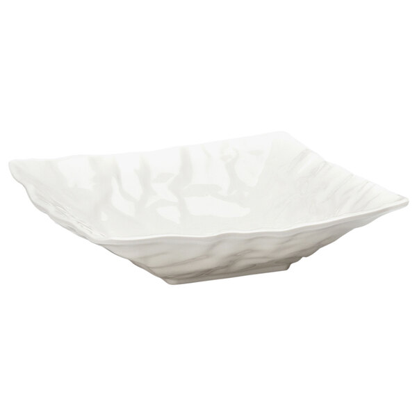 A white square bowl with crinkled edges.