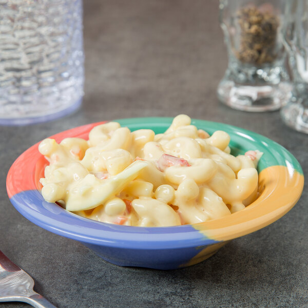 A colorful bowl of macaroni and cheese in a GET Diamond Celebration melamine bowl.