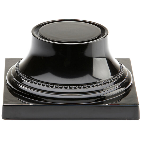An Elite Global Solutions Venetian black pedestal with a round base.