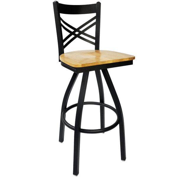 A black metal BFM Seating barstool with a natural wood seat.