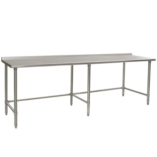 A long rectangular Eagle Group stainless steel work table with metal legs.