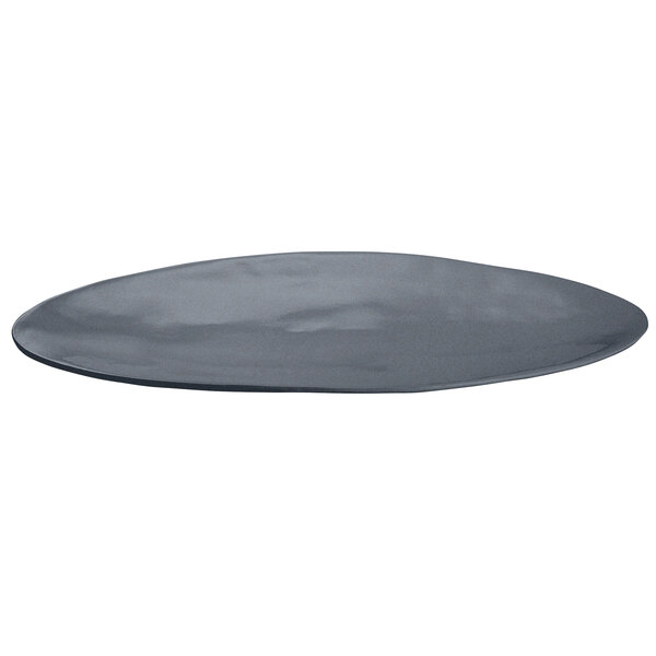 A black Tablecraft cast aluminum oblong platter with blue speckle on a grey surface.