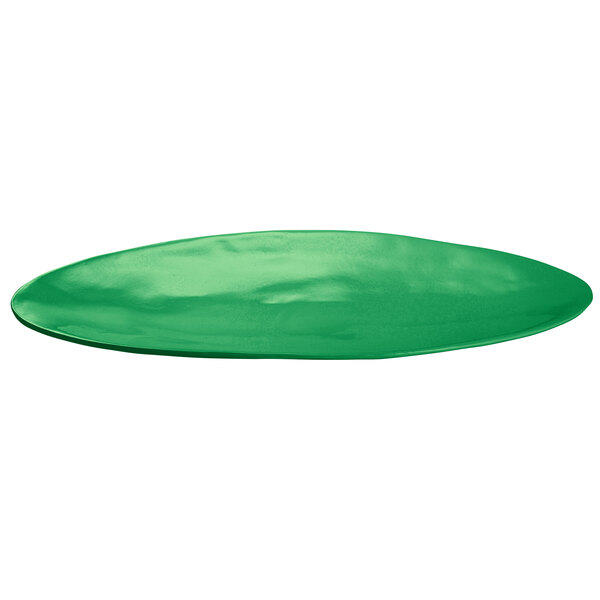 A green oval platter on a white background.