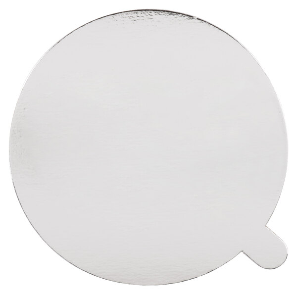 A white round foil board lid with a white circle in the middle.