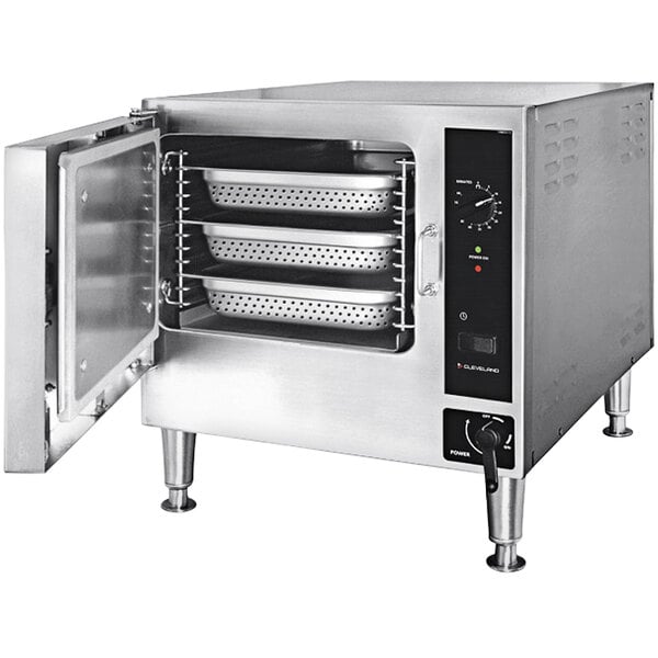 A Cleveland stainless steel countertop steamer with trays inside.